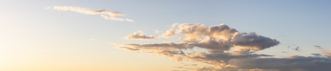 Panoramic View of Cloudscape with puffy sky and clear sunny sunlight during a colorful sunset or sunrise. Taken on the West Coast of British Columbia, Canada.