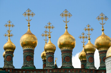 Obraz premium Domes of Terem Churches complex in Moscow Kremlin. The complex consists of four Terem churches that are located at different levels and connected with the passages.