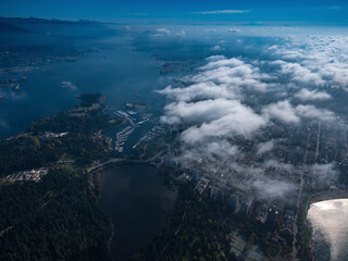 Stock aerial photo of scattered clouds over Stanley Park and downtown Vancouver, Canada