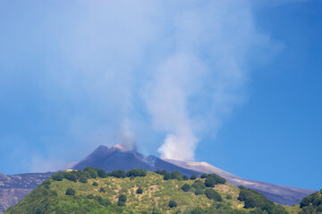 Eruption of Volcano Mt Etna and rising of a tall column of smoke on August 11, 2011 - Catania, Sicily
