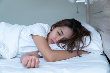 Young Woman Sleeping Cozily