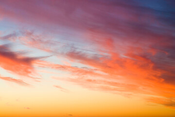 Fototapeta premium Orange Sunset in cloudy sky from Cape Point in Cape Town, South Africa