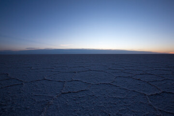 View of the Salar of Uyuni early in the morning during the dry season, the salt plains are a completely flat expanse of dry salt. Bolivia