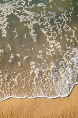 wave and sand on the beach 