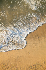 wave and sand on the beach 
