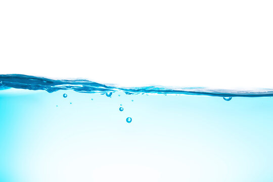 Water waves cause bubbles and splatter in clear blue water.