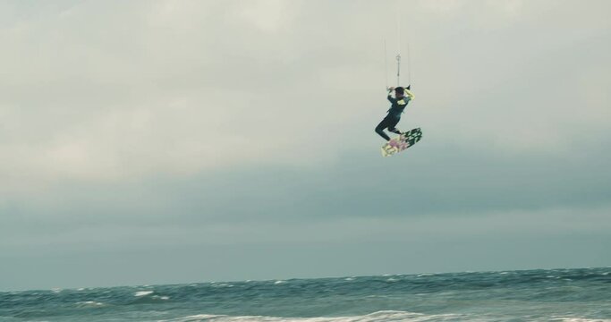 kite surfing in the sea jumping high