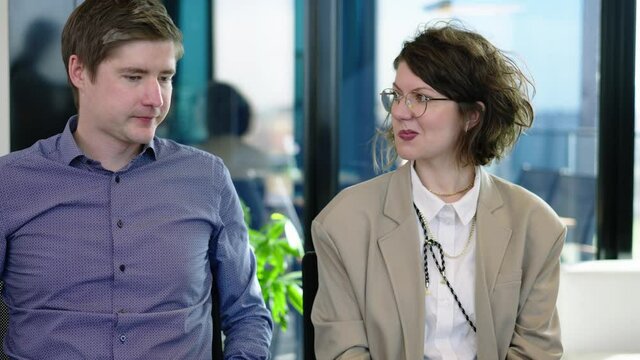Skeptical couple discusses contract and is unsure in conversation with consultant, who explains the contract with all details.
Couple meet lawyer dissatisfied with terms of contract, refuse to sign.