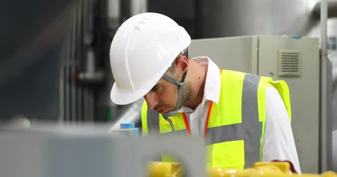 Electrical engineer working and checking the operation of the machine.