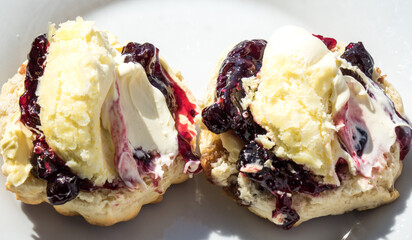 Cream tea - a clotted cream and blackcurrant jam scone