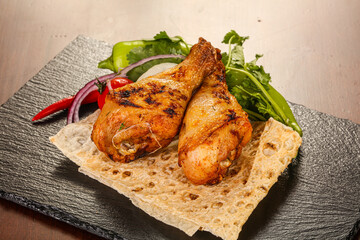 Chicken leg barbecue served salad leaves