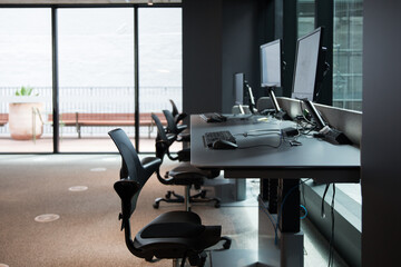 Office space row desks chairs window monitor computers call centre business work commercial real estate fitout