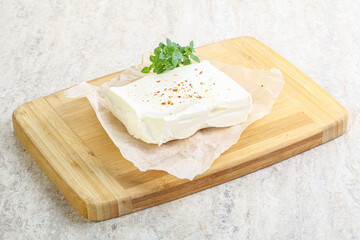 Greek Feta cheese over board