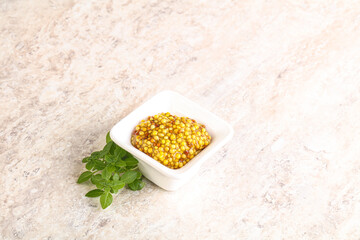 Grain mustard sauce in the bowl