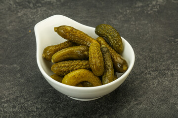 Pickled gherkin in the bowl