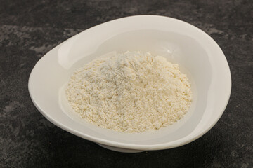 Wheat flour heap in the bowl