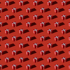 Pattern of gift boxes on red background