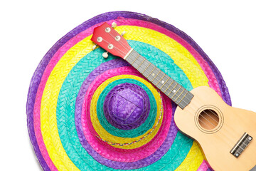 Mexican sombrero and guitar on white background