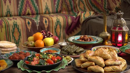 Arabic Cuisine: Middle Eastern traditional lunch on the table. Iftar food during month of Ramadan. The Meal eaten by fasting muslims after sunset. Moroccan or Egyptian Oriental restaurant 