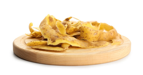 Board with potato peels on white background