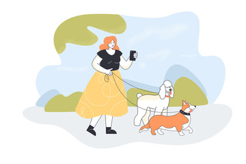 Woman with phone walking dogs. Cartoon human on walk with corgi and poodle in park flat vector illustration. Pets, outdoor activity, lifestyle concept for banner, website design or landing web page