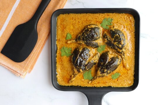 Baghare baingan, Baingan masala, Eggplant or brinjal curry, Bharli vangi. Khare vanga served in pan. Copy space.