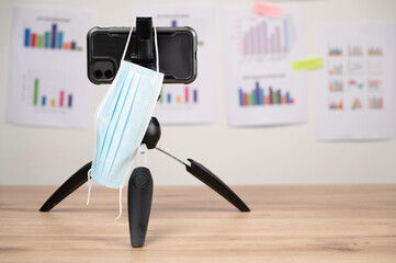 smartphone and Face mask for teacher or tutor teaching online at home,New normal lifestyle during...