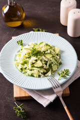 Healthy salad. Detox Spring vegan salad with cabbage, cucumber, green onion and parsley