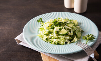 Healthy salad. Detox Spring vegan salad with cabbage, cucumber, green onion and parsley