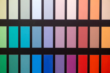 Paint color swatches in the background interior design studio. Selection Various colors and shades of paint for interior design and decoration works