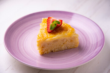 Fruit cake made with apple and pear on a sponge cake.