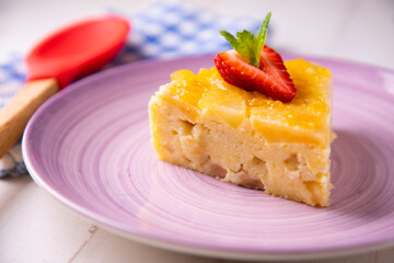Fruit cake made with apple and pear on a sponge cake.