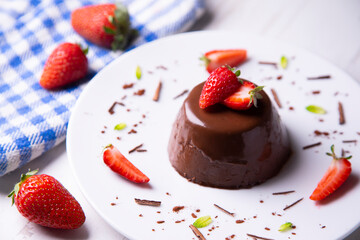Chocolate pannacotta with strawberries.
