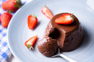 Chocolate pannacotta with strawberries.