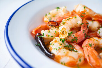 Gambas al ajillo. Shrimp Scampi. Traditional Spanish tapa with prawns cooked in oil with garlic and chilli.