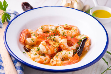 Gambas al ajillo. Shrimp Scampi. Traditional Spanish tapa with prawns cooked in oil with garlic and chilli.