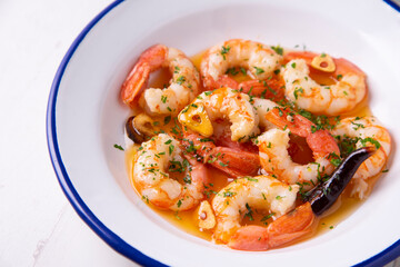 Gambas al ajillo. Shrimp Scampi. Traditional Spanish tapa with prawns cooked in oil with garlic and chilli.
