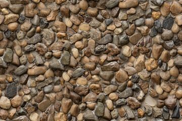 seamless texture of stone wall river rock pattern nature background.