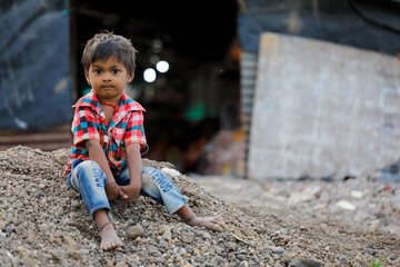 indian poor child playing at home