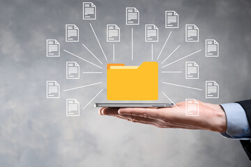 Document Management System (DMS).Businessman hold folder and document icon.Software for archiving,...