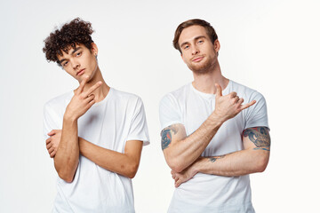 two guys in white t-shirts next to friendship communication emotions