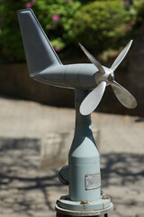 An anemometer with a propeller on a sunny day