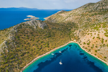 Obraz premium Yacht sailing near the rocky coast in Turkey. Luxury vacation at sea