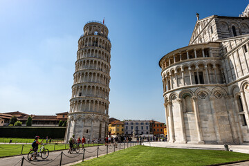 The Leaning Tower of Pisa and the Cathedral (Duomo di Santa Maria Assunta), Piazza dei Miracoli (Square of Miracles). Tuscany, Italy, Europe.