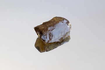Macro shooting of natural rock set of morion, smoky quartz gem mineral stones on mirror background