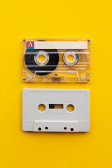 vintage white cassette tape on a bright yellow background