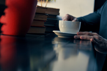 business man in a suit sitting in a cafe leisure manager finance