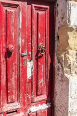 Malta, Marsaxlokk, August 2019. Red antique door on the island of Malta.