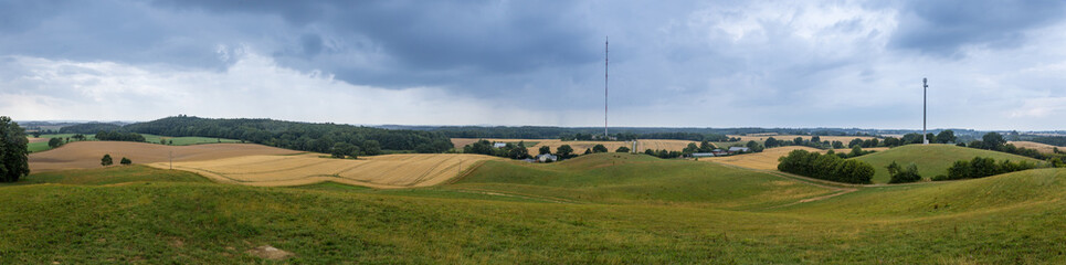 Fototapeta na wymiar Panorama of hilly landscape with fields and meadows in the north of Germany, Europe