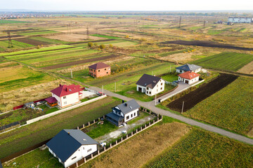 Aerial view of home roofs in residential rural neighborhood area.
